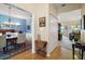 Open hallway connecting the dining room and living areas with hardwood floors at 809 Northside Dr, Mount Dora, FL 32757