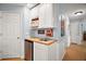 This kitchenette boasts white cabinets and a convenient wet bar area at 809 Northside Dr, Mount Dora, FL 32757