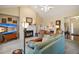 Cozy living room features a fireplace, comfortable seating, and ample natural light at 809 Northside Dr, Mount Dora, FL 32757