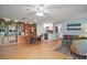 Open living room featuring a built-in bookcase and a kitchenette area at 809 Northside Dr, Mount Dora, FL 32757