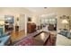 Spacious living room with hardwood floors leading to a dining area at 809 Northside Dr, Mount Dora, FL 32757