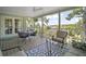 Spacious covered patio with beautiful views, outdoor seating and dining area at 809 Northside Dr, Mount Dora, FL 32757