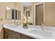 Bathroom featuring a double sink vanity with modern fixtures at 8664 Bridgeport Bay Cir, Mount Dora, FL 32757