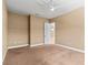 Spacious bedroom featuring a ceiling fan and ensuite bathroom at 8664 Bridgeport Bay Cir, Mount Dora, FL 32757