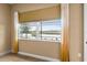 Bedroom with window and curtains providing natural light with a view of the lake at 8664 Bridgeport Bay Cir, Mount Dora, FL 32757