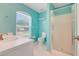 Bathroom featuring a vanity, a window, a toilet, and a glass-enclosed shower at 8709 Augusta Ct, Clermont, FL 34711