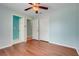 This bedroom features hardwood floors, a closet and ensuite bathroom at 8709 Augusta Ct, Clermont, FL 34711