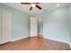 This is a view of the bedroom with ceiling fan and hardwood floors at 8709 Augusta Ct, Clermont, FL 34711