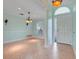 Bright open foyer with tile flooring, decorative lighting and arched doorway at 8709 Augusta Ct, Clermont, FL 34711