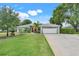 Charming single-Gathering home with well-manicured landscaping and an attached two-car garage at 8709 Augusta Ct, Clermont, FL 34711