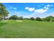 Enjoy easy access to the beautifully maintained golf course, surrounded by lush greenery and mature trees at 8709 Augusta Ct, Clermont, FL 34711