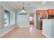 Eat-in kitchen featuring tile flooring, stainless steel appliances, and ample natural light at 8709 Augusta Ct, Clermont, FL 34711