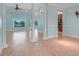 Open living space with tile flooring, decorative pillars, and a view of the pool area at 8709 Augusta Ct, Clermont, FL 34711