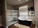 Spa-like bathroom featuring modern soaking tub, walk-in glass shower, and contemporary fixtures at 9010 Laurel Ridge Dr, Mount Dora, FL 32757