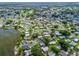 Aerial view of the neighborhood featuring beautiful lakes and well-maintained landscaping at 941 Tarrson Blvd, Lady Lake, FL 32159