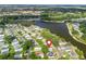 Aerial view of a waterfront property, pinpoints the property's location in the serene neighborhood at 941 Tarrson Blvd, Lady Lake, FL 32159