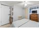 Comfortable bedroom features bright white walls and trim, ceiling fan, and closet space at 941 Tarrson Blvd, Lady Lake, FL 32159