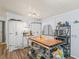 Bright kitchen with sleek appliances, custom island, and hardwood flooring at 941 Tarrson Blvd, Lady Lake, FL 32159