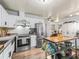 Modern kitchen featuring stainless appliances, a functional island, and stylish cabinetry at 941 Tarrson Blvd, Lady Lake, FL 32159