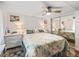 Well lit bedroom features a mirrored closet and comfortable bedding at 941 Tarrson Blvd, Lady Lake, FL 32159