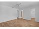 Spacious bedroom features wood-look floors and ensuite bath access at 9461 Se 173Rd Ln, Summerfield, FL 34491