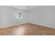 Bedroom with wood-look floors, ceiling fan and good natural light at 9461 Se 173Rd Ln, Summerfield, FL 34491