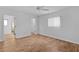 Bedroom features neutral walls, wood-look floors, and window view at 9461 Se 173Rd Ln, Summerfield, FL 34491