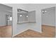 Bright living room with modern pendant lighting and breakfast bar at 9461 Se 173Rd Ln, Summerfield, FL 34491