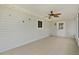 Enclosed patio features tile floor, ceiling fan, and access to the outdoors at 9461 Se 173Rd Ln, Summerfield, FL 34491