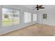 Sun room features ample natural light and wood look floors at 9461 Se 173Rd Ln, Summerfield, FL 34491