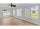 Sun room features ample natural light and wood look floors at 9461 Se 173Rd Ln, Summerfield, FL 34491