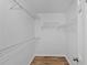 Walk-in closet features wire shelving and a door at 9461 Se 173Rd Ln, Summerfield, FL 34491