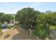 Overhead view of home with mature oak trees, an oversized lot, and close proximity to local attractions at 9752 County Road 121, Wildwood, FL 34785