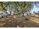 Spacious backyard with mature trees, play set, and plenty of room for outdoor activities at 9752 County Road 121, Wildwood, FL 34785