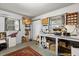 Finished basement area with ample workspace and natural light from two windows at 9752 County Road 121, Wildwood, FL 34785