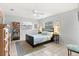 Comfortable bedroom featuring neutral walls, tile floors and two windows at 9752 County Road 121, Wildwood, FL 34785