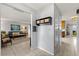 Hallway featuring built-in storage, with a view of the living room and kitchen at 9752 County Road 121, Wildwood, FL 34785