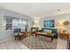 Cozy living room with natural light, comfortable seating, and stylish decor creating a warm atmosphere at 9752 County Road 121, Wildwood, FL 34785