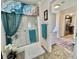 Practical bathroom featuring a shower-tub, adjacent laundry area, and neutral decor at 102 Dogwood Trl, Leesburg, FL 34748