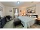 Comfortable bedroom with a large bed, stylish decor, and a relaxing atmosphere at 102 Dogwood Trl, Leesburg, FL 34748