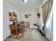 Bedroom featuring a quaint desk setup, cozy floor mattress, and window with curtains to let the light in at 102 Dogwood Trl, Leesburg, FL 34748