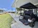 Covered carport featuring a golf cart at 102 Dogwood Trl, Leesburg, FL 34748