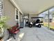 Covered parking featuring golf cart and seating at 102 Dogwood Trl, Leesburg, FL 34748
