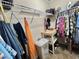 Walk-in closet with ample storage, including shelves, hanging space, and a small table at 102 Dogwood Trl, Leesburg, FL 34748