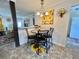 Cozy dining area features sunflower decor and a stylish table set for four at 102 Dogwood Trl, Leesburg, FL 34748