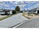 Charming exterior featuring a well-maintained driveway and landscaping at 102 Dogwood Trl, Leesburg, FL 34748