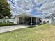 Well-maintained home with covered carport and golf cart parking at 102 Dogwood Trl, Leesburg, FL 34748