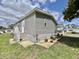 Home exterior view featuring vinyl siding and landscaped yard at 102 Dogwood Trl, Leesburg, FL 34748