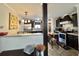 Modern kitchen with stainless steel appliances, dark cabinetry, and a breakfast bar at 102 Dogwood Trl, Leesburg, FL 34748