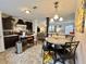 Well-equipped kitchen featuring modern appliances, adjacent dining area, and an open layout at 102 Dogwood Trl, Leesburg, FL 34748